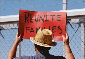  ?? Matt York / Associated Press 2018 ?? A protester rallies outside an immigratio­n facility in Fabens, Texas, where tent shelters were being used in 2018 to house separated family members.