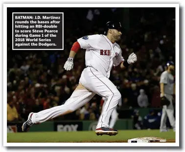  ??  ?? BATMAN: J.D. Martinez rounds the bases after hitting an RBI-double to score Steve Pearce during Game 1 of the 2018 World Series against the Dodgers.