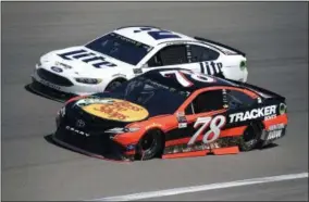  ?? DAVID BECKER — THE ASSOCIATED PRESS ?? Martin Truex Jr. (78) leads Brad Keselowski (2) during the NASCAR Cup Series auto race Sunday at Las Vegas Motor Speedway in Las Vegas. Truex won the race.