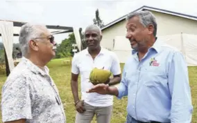  ?? ?? Jamaica Broilers Group (JBG) President & CEO Chris Levy (right) caught up with execs Mike Jones (left), director of sales and marketing,the Best Dressed Chicken Division, Jamaica Broilers Group, and Dave Fairman, VP, The Best Dressed Chicken Division, Jamaica Broilers Group.