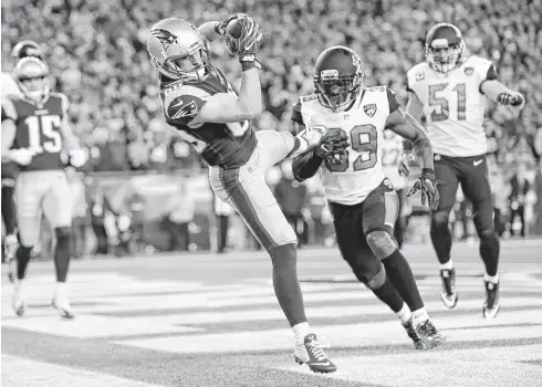  ?? David J. Phillip / Associated Press ?? Danny Amendola catches the game-winning touchdown pass in the AFC championsh­ip game. He has shown a knack for big plays in the playoffs.