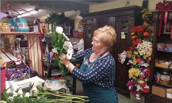  ?? DONNA ROVINS - MEDIANEWS GROUP PHOTO ?? Judy Leister works on a bridal bouquet at Levengood’s Flowers in Amity Township, Berks County. Leister is celebratin­g her 50th anniversar­y with the company.