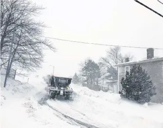  ?? TELEGRAM FILE PHOTO ?? A plow in downtown St. John’s on Jan. 17 during the blizzard just as the state of emergency was declared.