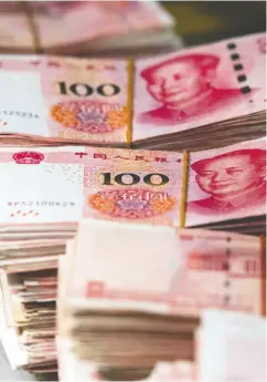  ?? JOHANNES EISELE / AFP / GETTY IMAGES FILES ?? China’s currency, the yuan, is also fractional­ly higher than where it was in November 2016, and its government debt joins one of the world’s most coveted bond indexes.