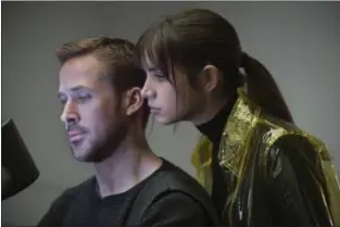  ?? WARNER BROS. PICTURES PHOTOS ?? Ryan Gosling and Ana de Armas share a scene in “Blade Runner 2049.”