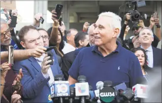  ?? Joshua Prezant/ AFP/Getty Images ?? Roger Stone, a longtime adviser to President Donald Trump, speaks outside court on Friday in Fort Lauderdale, Fla. Stone was taken into custody by heavily armed police in a predawn raid at his home in Fort Lauderdale after an indictment was unsealed in Washington by Special Counsel Robert Mueller.