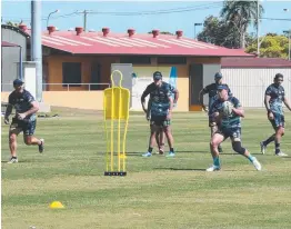  ?? Players go through a passing drills session yesterday. ??