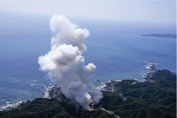  ?? AP ?? The Kairos rocket, operated by Tokyo start-up Space One, burns near the launch site in Kushimoto after its mission to put a satellite into orbit was aborted