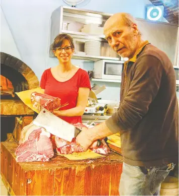  ?? — RICK STEVES/RICK STEVES' EUROPE ?? When it comes to fresh, delicious steaks in Montepulci­ano, Italy, leave it to cleaver — a.k.a. Giulio, who knows just what to serve hungry travellers.