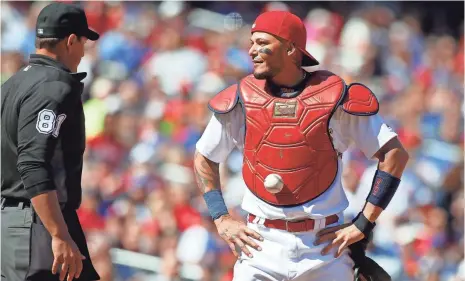  ?? SCOTT KANE, USA TODAY SPORTS ?? When the ball stuck to the chest protector of Cardinals catcher Yadier Molina on Thursday, the door was open for the Cubs.