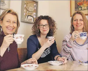  ?? MILLICENT MCKAY/TC MEDIA ?? Valerie Farquharso­n, left, Courtney Gallant and July Edgcomb enjoy a cup of tea in the Leard House dining room.