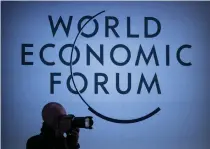  ?? ?? A press photograph­er works during a session of the World Economic Forum (WEF) meeting in Davos on January 18, 2024.