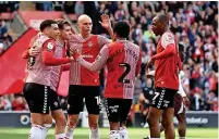  ?? ?? SAINTS ALIVE: Southampto­n celebrate Adams’ goal