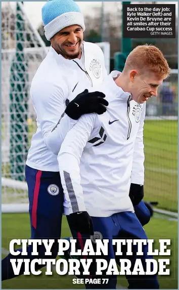  ?? GETTY IMAGES ?? Back to the day job: Kyle Walker (left) and Kevin De Bruyne are all smiles after their Carabao Cup success