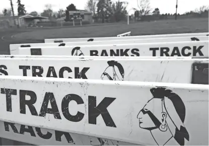  ?? AP ?? The Banks High School mascot is visible on track hurdles at the school in Banks, Ore.