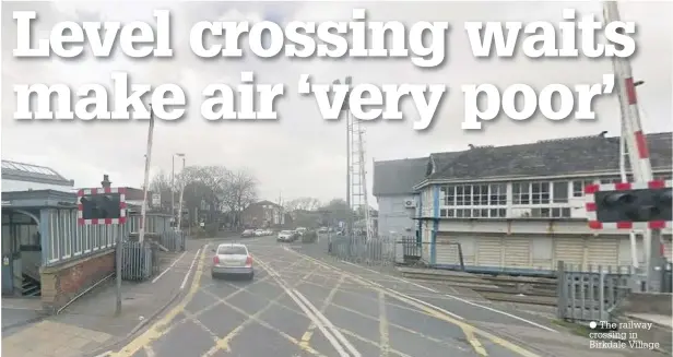  ??  ?? The railway crossing in Birkdale Village