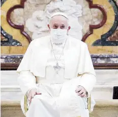  ?? REUTERS ?? Pope Francis wears a face mask while attending an interrelig­ious prayer service for peace in the Basilica of Santa Maria, a church on top of Rome’s Capitoline Hill, on Oct. 20.