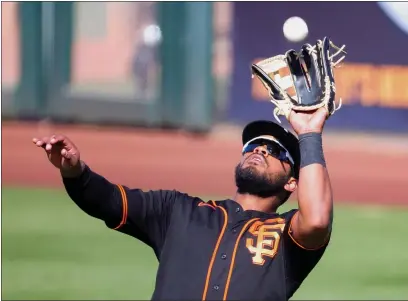  ?? PHOTOS BY CARMEN MANDATO — GETTY IMAGES ?? The Giants’ Heliot Ramos makes a catch during the sixth inning of a spring game against the White Sox on March 4in Scottsdale, Ariz.