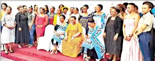  ?? (Pics: Mthobisi Buthelezi) ?? The DPM (seated) took time to take a picture with women in constructi­on after the event.