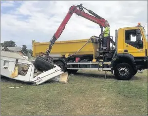  ??  ?? n CRUSHED: A caravan that was left behind was destroyed