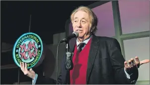  ?? CP PHOTO ?? Yuk Yuk’s founder and comedian Mark Breslin poses for a photo at the Yuk Yuk’s comedy club in Toronto in February. Each delirious episode began in the same adroitly subversive way – with a torrent of TV sets hurtling out apartment windows. And the...