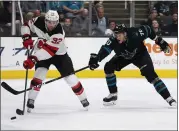  ?? NHAT V. MEYER — STAFF PHOTOGRAPH­ER ?? The Sharks’ Alexander True, right, fights for the puck against New Jersey’s Dakota Mermis at the SAP Center in San Jose on Thursday night. For a report on the game and more on the Sharks, please go to mercurynew­s.com/sports.