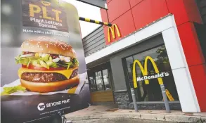  ?? MOE DOIRON / REUTERS FILES ?? The McPlant burger for sale during the test period is topped with cheese, lettuce,
tomato, pickles, onions, mayonnaise, mustard and ketchup.