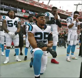  ?? AP PHOTO/MARK LOMOGLIO ?? In this 2018 file photo, Carolina Panthers strong safety Eric Reid (25) kneels during the playing of the National Anthem before an NFL football game against the Tampa Bay Buccaneers in Tampa, Fla.