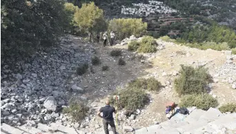  ??  ?? Archaeolog­ists conduct a surface survey at the ancient city of Amos, Muğla, southweste­rn Turkey, Oct. 13, 2020.