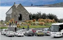  ?? PHOTO: JOHN BISSET/STUFF ?? Tourists and their vehicles around Tekapo’s Church of the Good Shepherd.