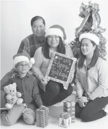  ?? CONTRIBUTE­D PHOTO ?? Dismissed Iloilo City Mayor Jed Patrick Mabilog posts on his FB a Christmas family photo with greetings from him, his wife Victoria and their two children.