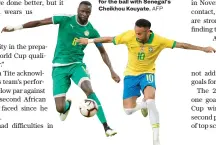  ?? AFP ?? Brazil's Neymar fights for the ball with Senegal's Cheikhou Kouyate.