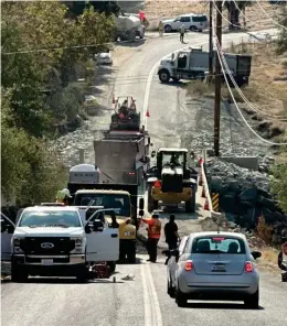  ?? ?? Equipment all over the place working on Lower Globe Bridge to prepare it for asphalt on Tuesday.