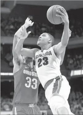  ?? Ezra Shaw Getty Images ?? GONZAGA’S ZACH NORVELL JR. drives to the basket against Ohio State’s Keita Bates-Diop in the second round of the NCAA tournament.