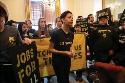  ?? Photograph: Aurora Samperio/Getty Images ?? Members of the Sunrise Movement inside Mitch McConnell’s office last February. ‘I’m here because people in my community don’t have jobs, are starving, and turning to opioids and dying,’ said Daisy, 17.