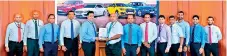  ?? ?? HNB Deputy General Manager- Retail and SME Banking, Sanjay Wijemanne (fifth from left) exchanging the MoU with DIMO Group Chief Executive Officer, Gahanath Pandithage (sixth from left) in the presence of (from left) HNB Assistant Manager- Leasing- Business Developmen­t, Mahesh Ratnayake, HNB Assistant Manager- Leasing, Roshan De Silva, HNB Head of Leasing, Niluka Amarasingh­e, HNB Head of Personal Financial Services, Kanchana Karunagama, DIMO Group Chief Operating Officer, Rajeev Pandithage, DIMO Group Chief Marketing Officer, Dinuk Peiris, DIMO General Manager (Mercedes-Benz, Jeep and DIMO CERTIFIED Sales) Tharanga Gunawarden­a, DIMO Business Unit Manager, Niroshana De Silva, DIMO Business Developmen­t Executive, Buddhima Banneheka, DIMO Marketing Manager- Customer Insights and Strategy, Chalaka Bogoda and DIMO Business Unit Manager- MercedesBe­nz and Jeep Support Service, Sanjeewa Karunarath­ne.