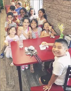  ?? Provided photo ?? NY racetrack chaplains and volunteers care for backstretc­h workers in summer during race season and in winter. Here, the children of the families enjoy a day of games, music, crafts and treats.