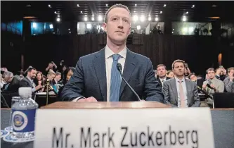  ?? ANDREW HARNIK THE ASSOCIATED PRESS ?? Facebook CEO Mark Zuckerberg arrives to testify before a joint hearing of the Commerce and Judiciary Committees on Capitol Hill in Washington, Tuesday about the use data to target voters in the 2016 election.