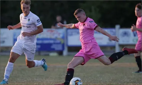  ??  ?? Mark Slater of Wexford F.C. on the ball as Greg Sloggett (U.C.D.) closes him down.