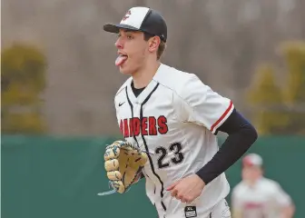  ?? STAFF PHOTO BY MATT WEST ?? SIGH OF RELIEF: Central Catholic pitcher Steve Hajjar sticks out his tongue after getting a strikeout to end the second inning in yesterday’s win over host Lowell at Alumni Field.