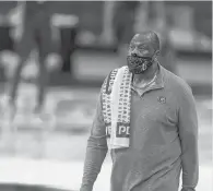  ?? PETERSON/AP JOHN ?? Georgetown head coach Patrick Ewing wearing a towel over his shoulder, an homage to his former coach, John Thompson.