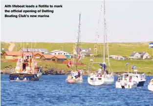  ??  ?? Aith lifeboat leads a flotilla to mark the official opening of Delting Boating Club’s new marina