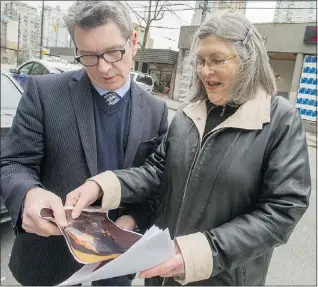  ?? RIC ERNST/PNG ?? Sharon Promislow and Coun. George Affleck stand outside the HEAT homeless shelter in the 1200-block Seymour Street Wednesday.