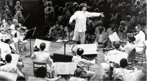  ?? WAlter h. scott ?? Above: Seiji Ozawa, the Boston Symphony Orchestra’s longest-serving music director, leading the BSO in the Shed at Tanglewood. Left: Ozawa with his children Seira and Yukiyoshi.