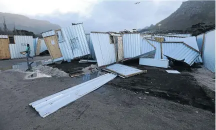  ?? PHOTOS: ESA ALEXANDER ?? Structures destroyed in Hout Bay’s Imizamo Yethu settlement due to severe weather conditions in Cape Town .