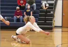  ?? TIM PHILLIS — FOR THE NEWS-HERALD ?? A Kirtland player goes for a dig against Rootstown on Oct. 28.