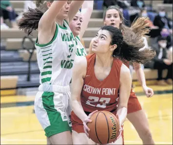  ?? MICHAEL GARD / POST-TRIBUNE ?? Crown Point’s Nikki Gerodemos heads to the basket during a game at Valparaiso on Friday.