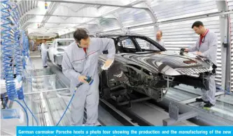  ??  ?? German carmaker Porsche hosts a photo tour showing the production and the manufactur­ing of the new Macan in Leipzig, Germany, in this file photo.— Reuters