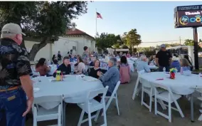  ?? PHOTO FOR THE RECORDER BY JAMIE A. HUNT ?? Guests enjoy a beautiful balmy evening after dinner at the Portervill­e Historical Museum Wine and Dine event on Saturday, April 30. There was a Silent and Live Auction which was well attended.