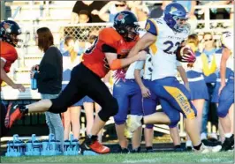  ?? PILOT PHOTO/RON HARAMIA ?? Culver’s Shane Shuman (left) chases after Triton’s Anthony Schuh (22). Both players were named first team ALL-HNAC.